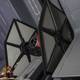 Disney Imagineers admire the real, full-size TIE Fighter inside Rise of the Resistance.